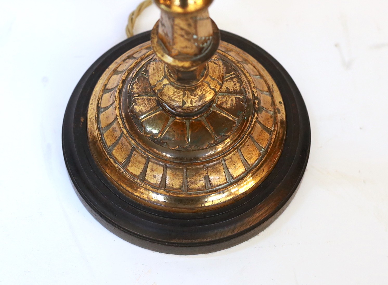 A late 19 century English lacquered bronze and glass table lamp with edged pink glass shade, height overall 51cm